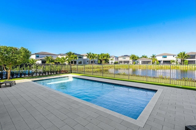 view of swimming pool featuring a water view