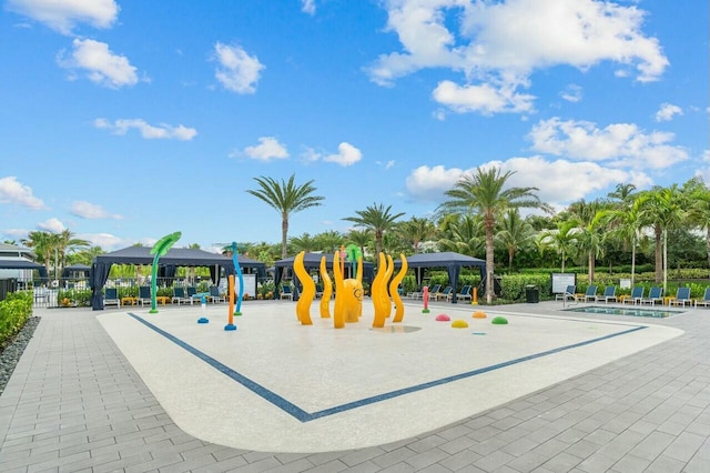 view of jungle gym with a gazebo and a community pool