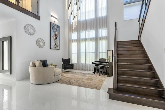 interior space featuring tile patterned flooring and a high ceiling