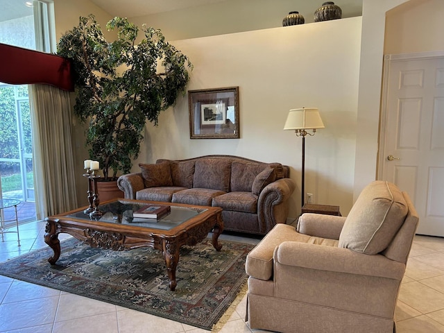 tiled living room featuring vaulted ceiling