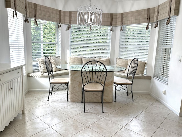 sunroom featuring an inviting chandelier and plenty of natural light