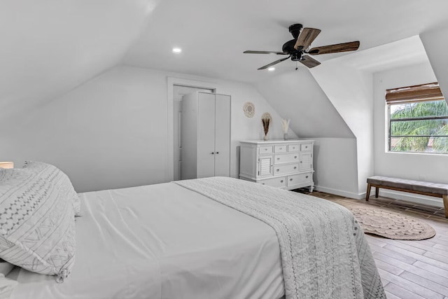 bedroom featuring baseboards, lofted ceiling, ceiling fan, wood finished floors, and recessed lighting