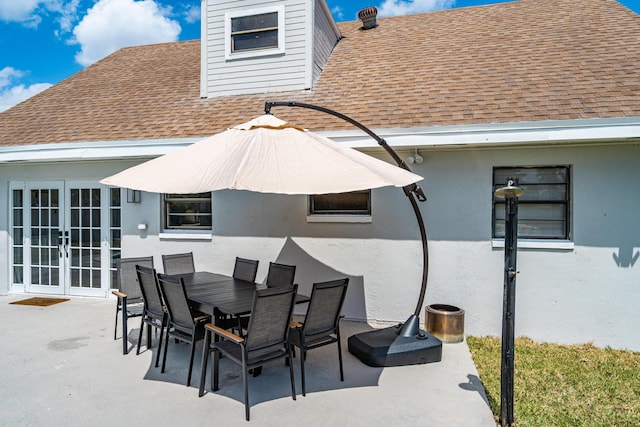 view of patio with outdoor dining area and french doors