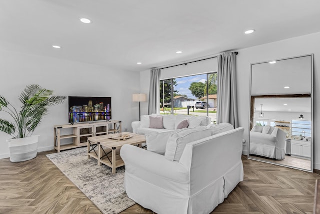 living room with baseboards and recessed lighting