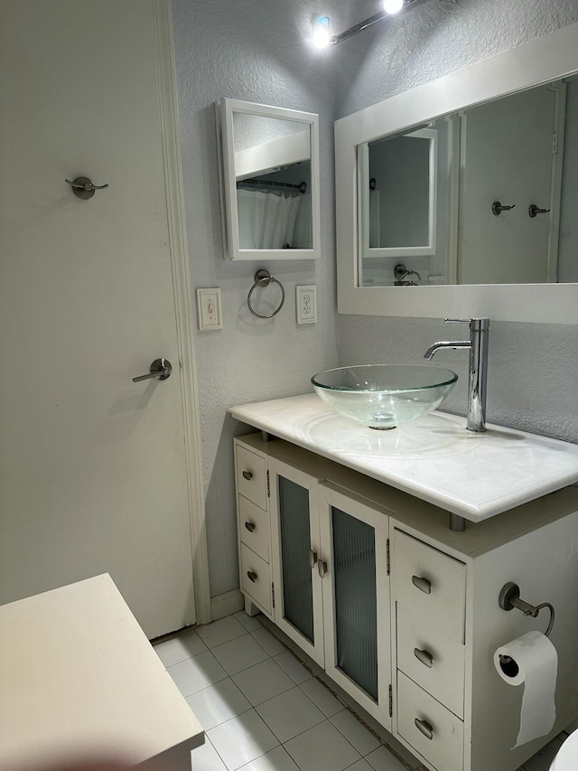 bathroom featuring tile patterned floors and vanity