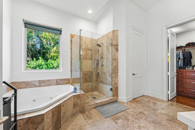 bathroom with separate shower and tub