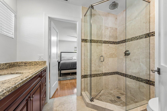 bathroom with vanity, toilet, and walk in shower