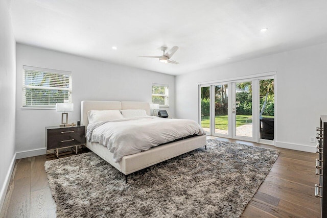 bedroom featuring access to exterior, ceiling fan, dark hardwood / wood-style flooring, and french doors