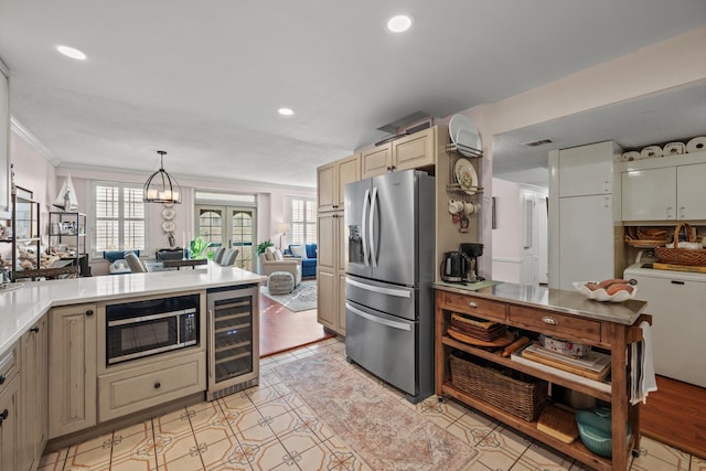 kitchen featuring stainless steel fridge, a wealth of natural light, beverage cooler, and built in microwave