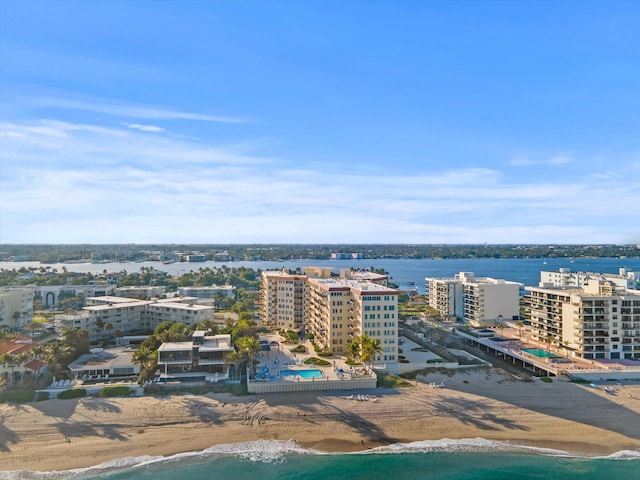 drone / aerial view featuring a view of the beach and a water view