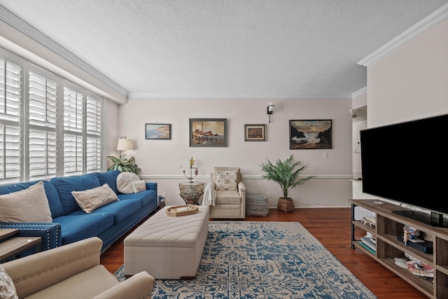 living room with a textured ceiling, ornamental molding, and dark wood-type flooring