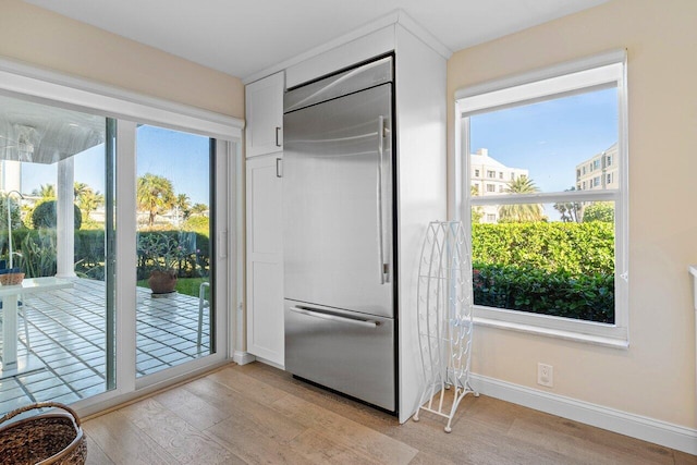 entryway with light wood-type flooring and a wealth of natural light