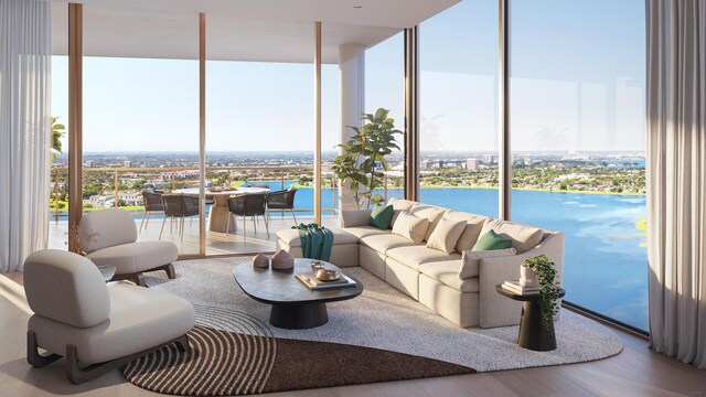 living room with a wealth of natural light, hardwood / wood-style flooring, and a wall of windows