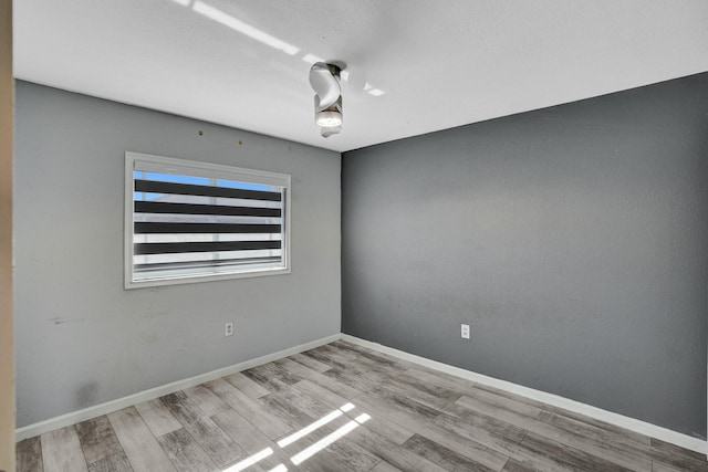 unfurnished room featuring light hardwood / wood-style flooring