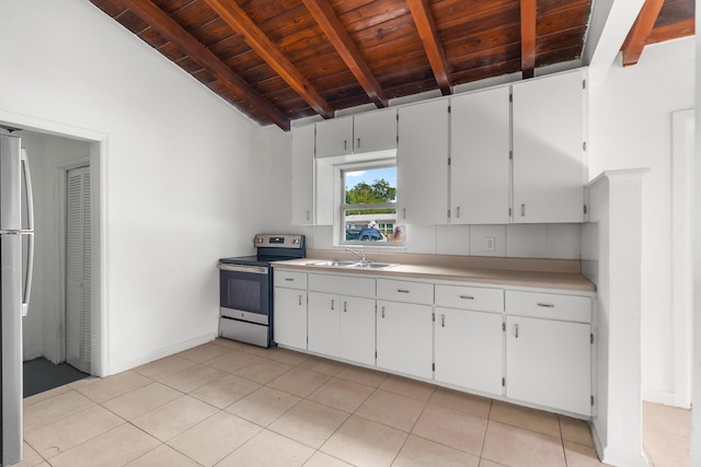 kitchen featuring white cabinets, appliances with stainless steel finishes, vaulted ceiling with beams, and wooden ceiling