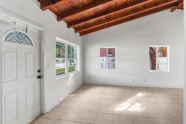 tiled foyer entrance featuring lofted ceiling with beams and wood ceiling