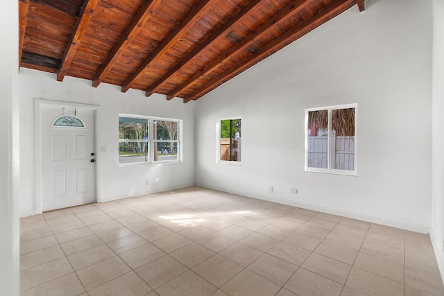 tiled foyer with beam ceiling, wood ceiling, and a wealth of natural light