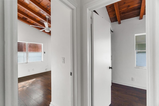 corridor featuring wood ceiling, dark wood-type flooring, and lofted ceiling with beams