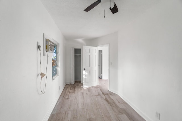 corridor with light hardwood / wood-style floors