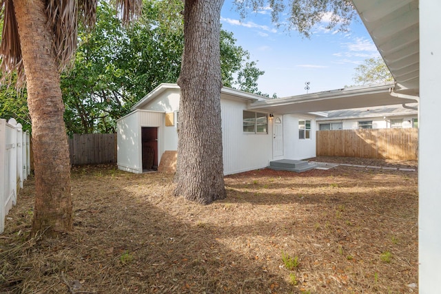 exterior space with a storage shed