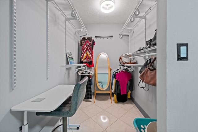 spacious closet featuring tile patterned floors