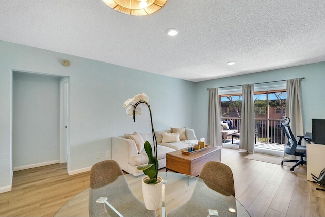 760 SE 2nd Ave Unit C203, Deerfield Beach, FL 33441 - dining space featuring a textured ceiling, light wood-style flooring, baseboards, and an office area