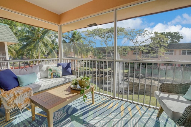 760 SE 2nd Ave Unit C203, Deerfield Beach, FL 33441 - sunroom featuring an outdoor living space and healthy amount of natural light