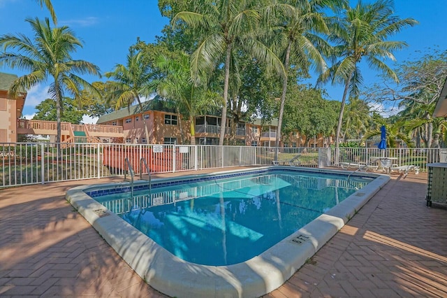 view of swimming pool with a patio