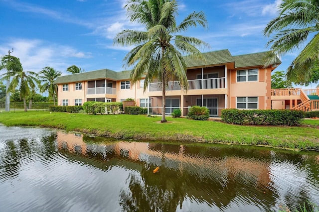 view of building exterior with a water view