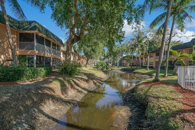 surrounding community with a water view