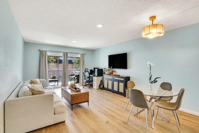 760 SE 2nd Ave Unit C203, Deerfield Beach, FL 33441 - living area featuring a textured ceiling, light wood-style floors, recessed lighting, and baseboards