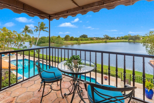 balcony with a patio and a water view