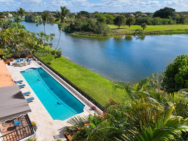 view of pool with a water view and a patio area