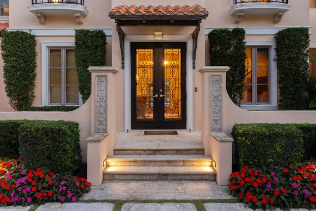 entrance to property featuring french doors