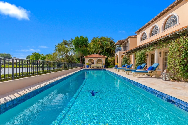 view of swimming pool with a patio