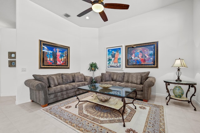 tiled living room with ceiling fan