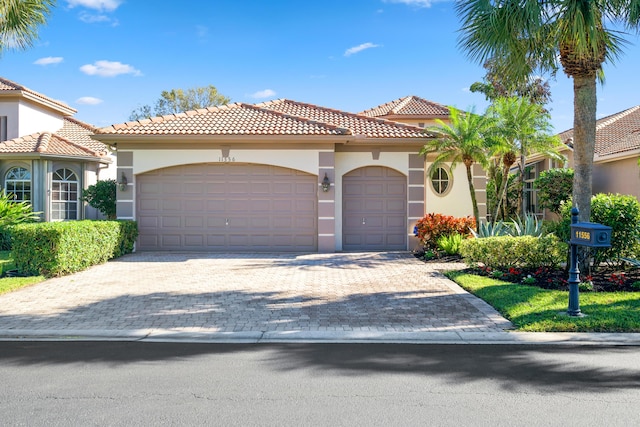 mediterranean / spanish-style house featuring a garage