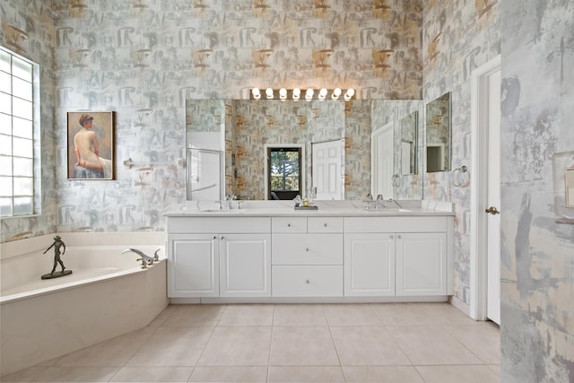 bathroom with tile patterned floors, plenty of natural light, and vanity