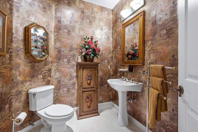 bathroom featuring tile patterned flooring and toilet