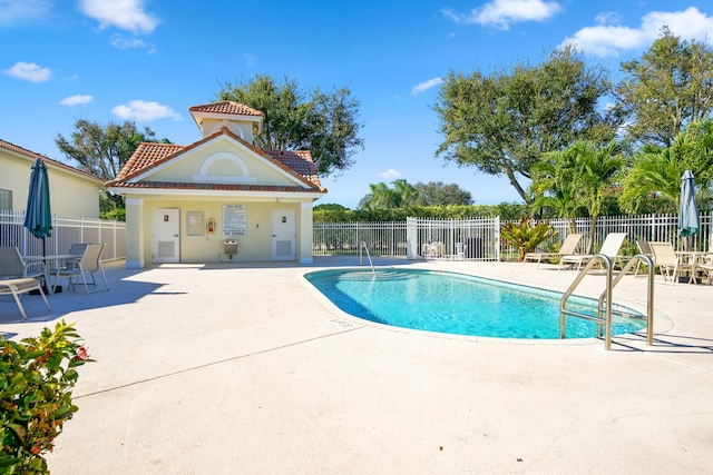 view of swimming pool featuring a patio area