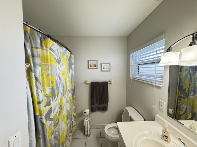 bathroom featuring tile patterned floors, vanity, and toilet