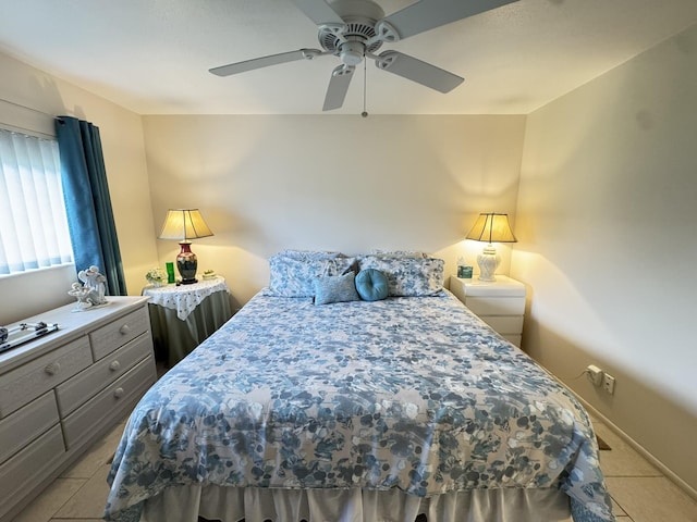 tiled bedroom with ceiling fan