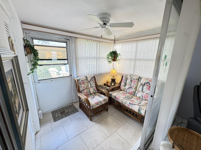 sunroom featuring ceiling fan