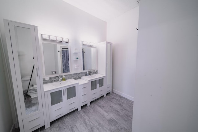 bathroom featuring vanity and hardwood / wood-style flooring