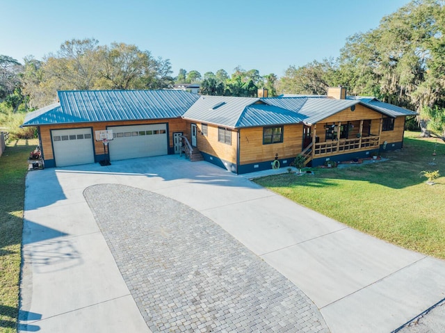 view of front facade with a front yard, a porch, and a garage