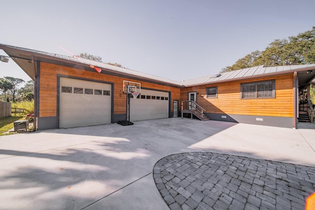 single story home with a garage