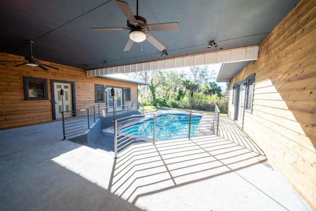 view of pool featuring ceiling fan and a patio area