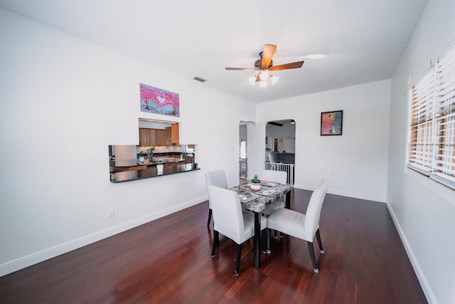 dining room featuring ceiling fan and dark hardwood / wood-style floors