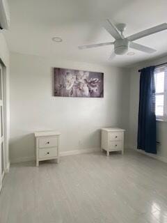 unfurnished bedroom featuring ceiling fan and baseboards