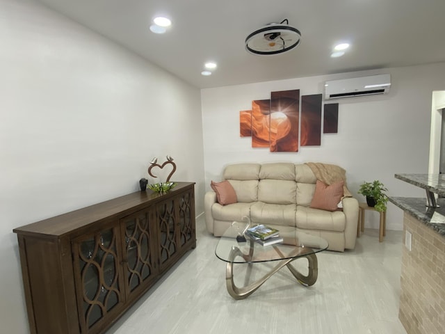 living area featuring recessed lighting, a wall mounted air conditioner, and light wood finished floors